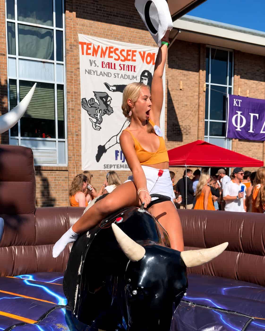 Guest riding the inflatable mechanical bull at a Knoxville TN party
