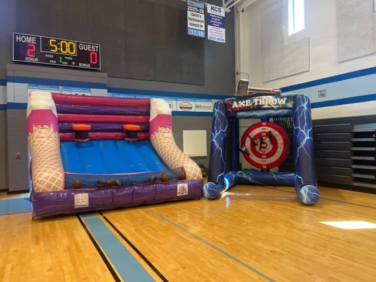 Inflatable game set up on a school gym floor for a PTO fun night
